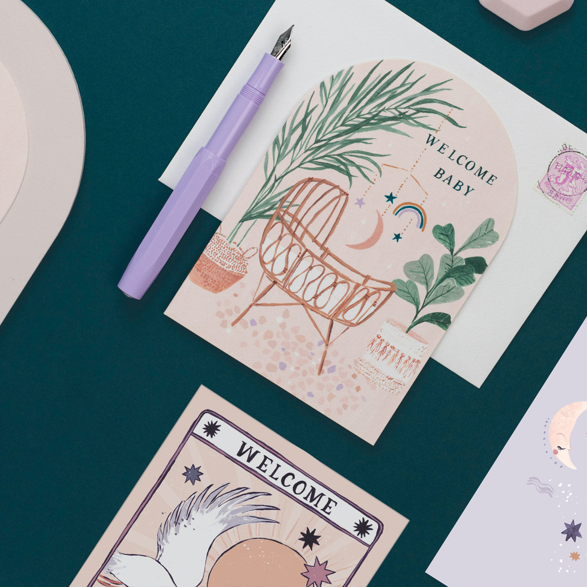 Gender neutral new baby card with unisex illustrated bamboo crib and bohemian colour palette.