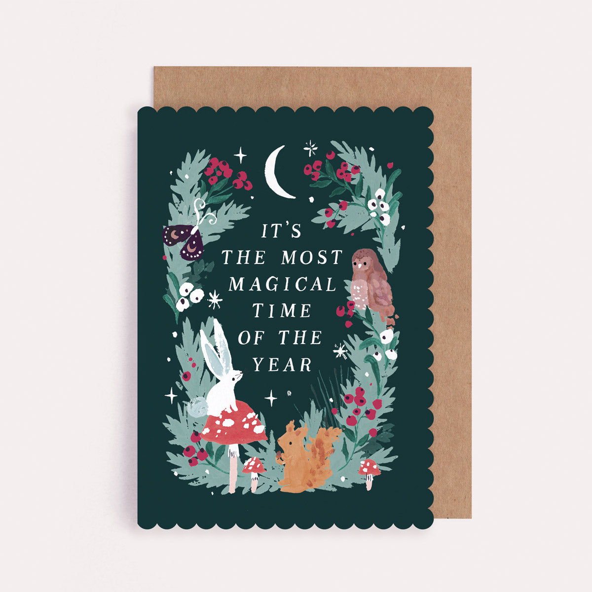 Christmas card with forest-themed illustration and text 'It's the most magical time of the year'.