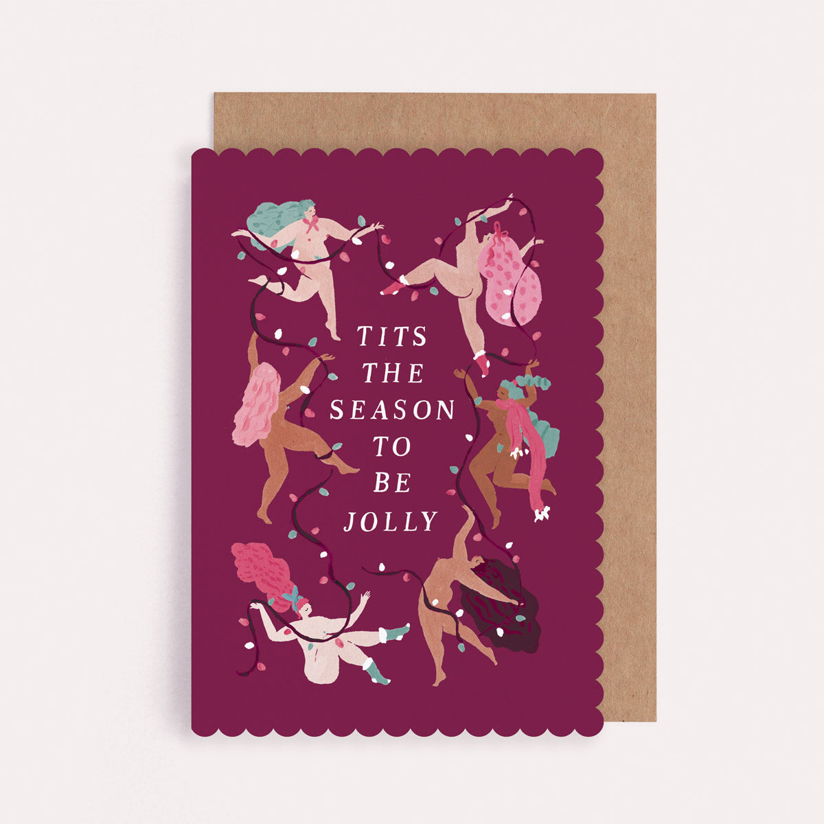 Christmas card with funny illustrations of dancing naked women decorating with a string of Christmas lights and the phrase tits the season to be jolly.