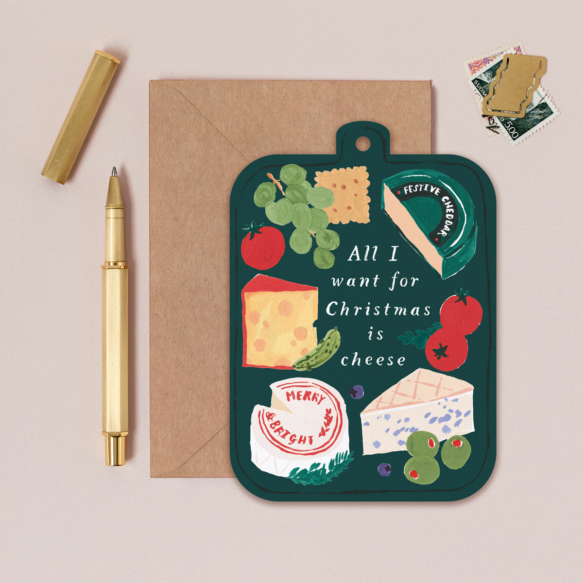 Chessboard Christmas card with cheese-themed illustration and envelope on a beige background