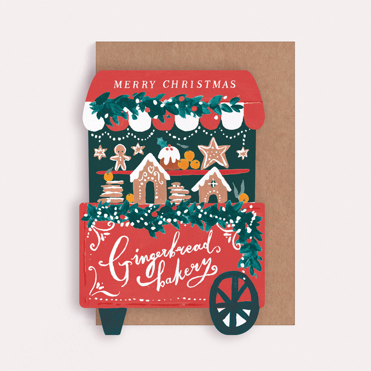 Christmas Greeting card with a gingerbread bakery shape design and 'Merry Christmas' text.