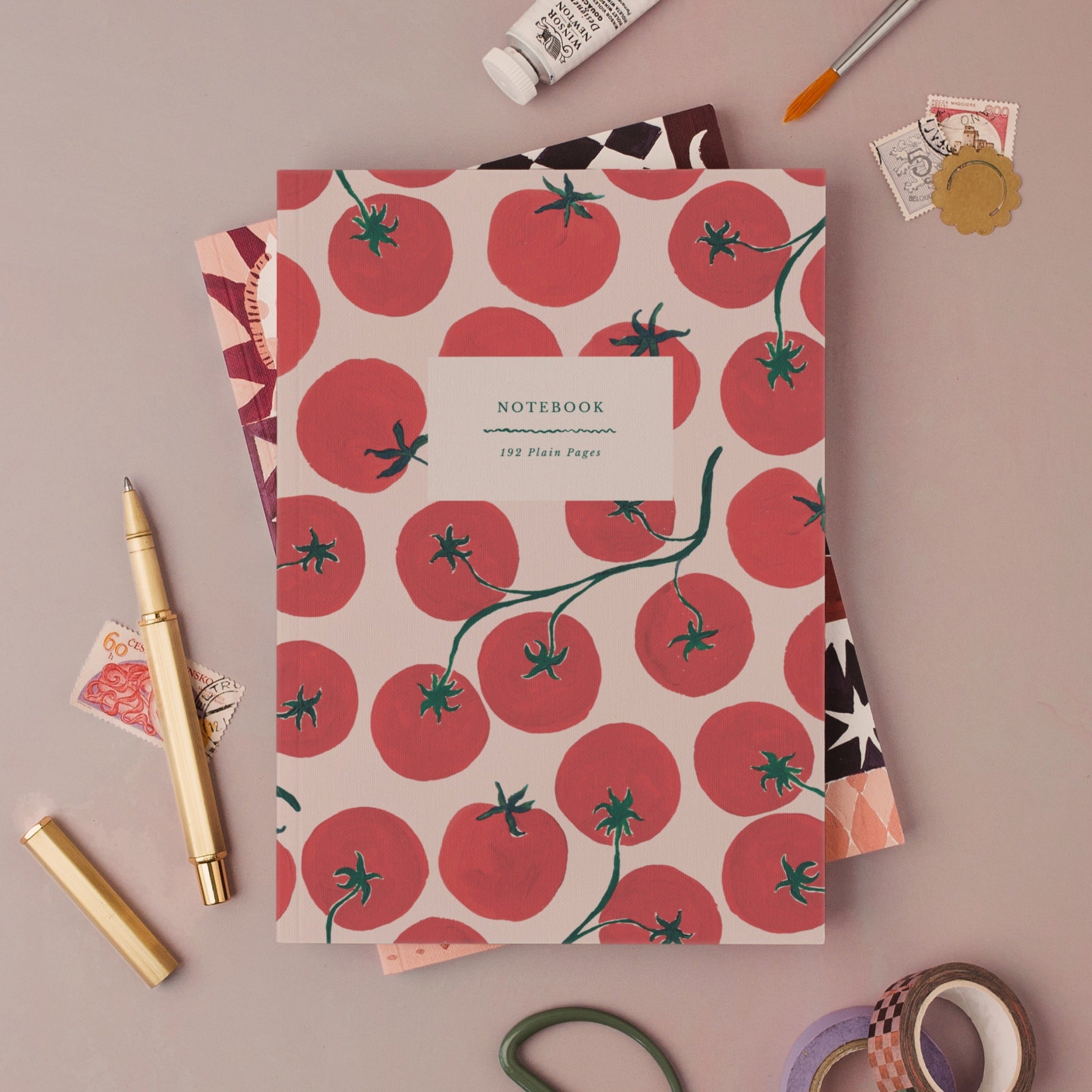 Tomatoes notebook, A5 plain page journal styled in a flat lay with a gold pen, paints and vintage stamps