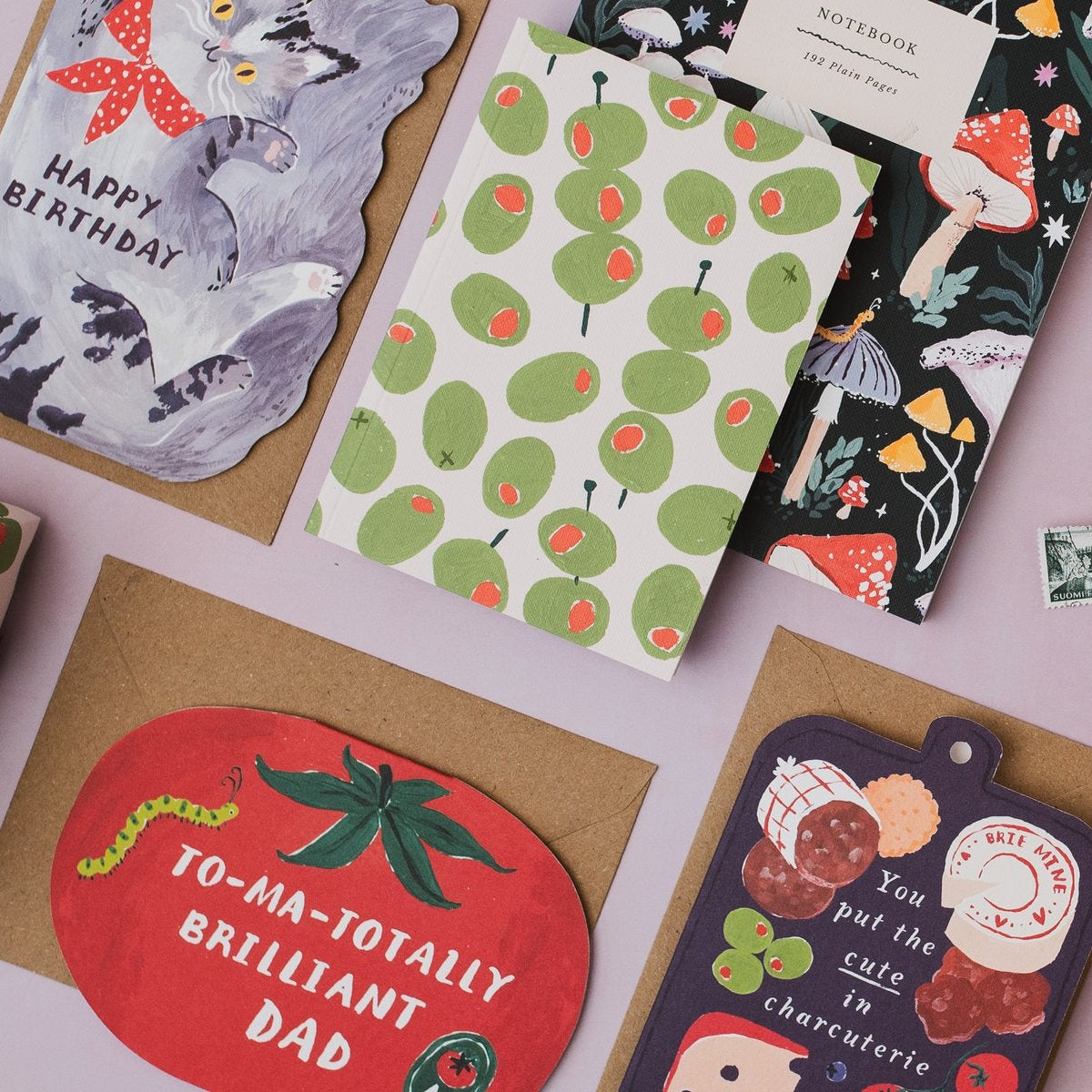 Sister Paper Co cards, notebooks and gift wrap styled in a flat lay