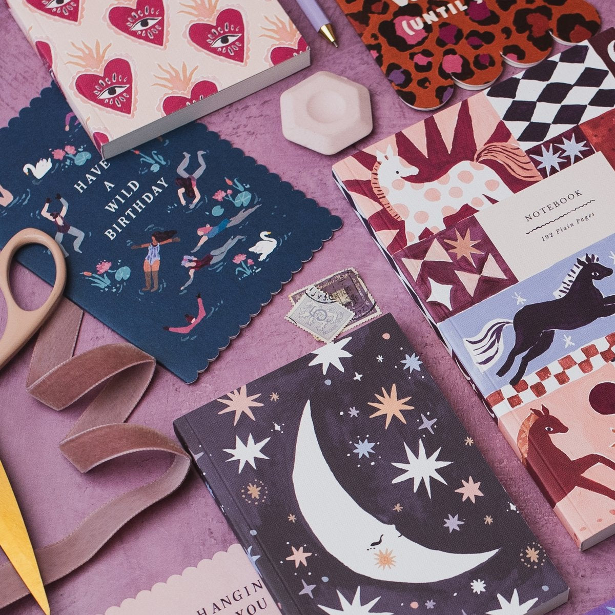 Sister Paper Co cards and notebooks styled in a flat lay