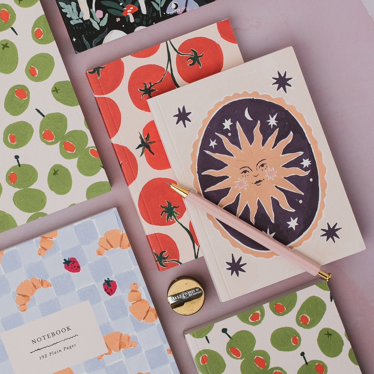 Sister Paper Co notebooks and pocket notebooks in a styled flat lay