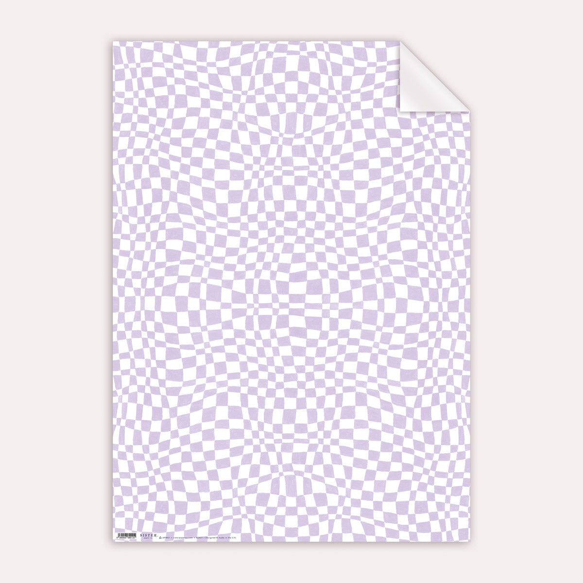 A lilac checkerboard print on wrapping paper from the female birthday wrapping paper collection at Sister Paper Co.