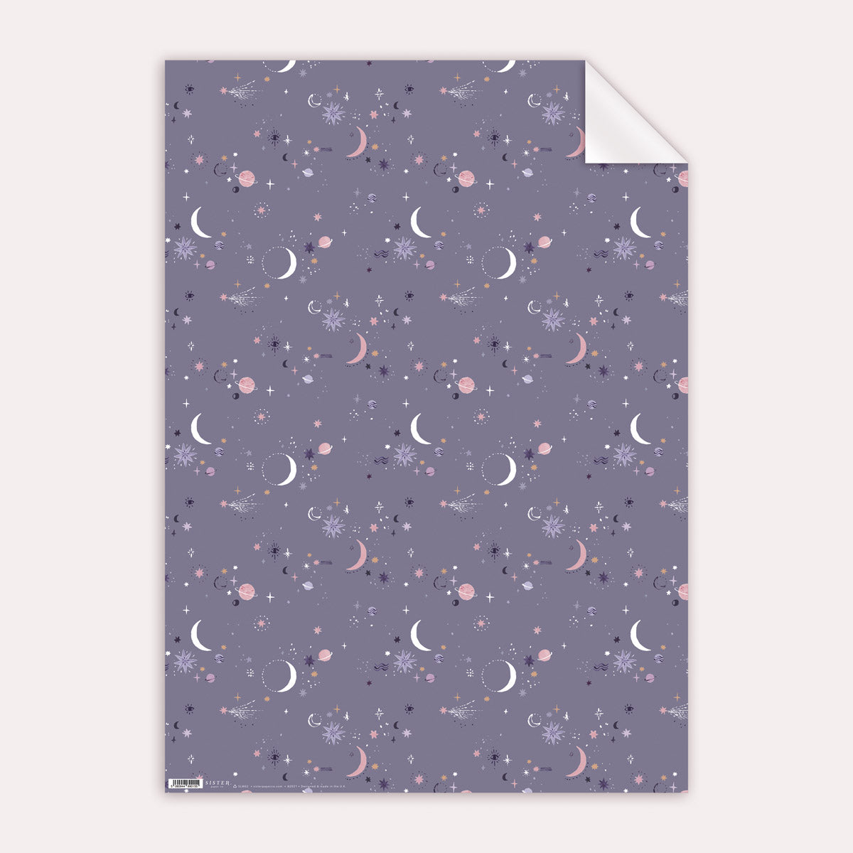 A cosmic, solar system print on wrapping paper from the female birthday wrapping paper collection at Sister Paper Co.