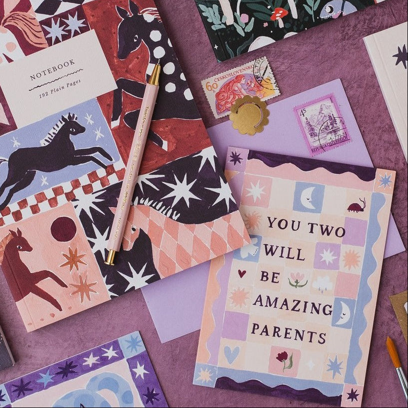 Amazing parents new baby card styled in a flat lay
