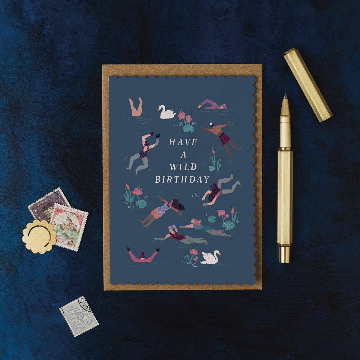 Wild swimming birthday card design shown close up