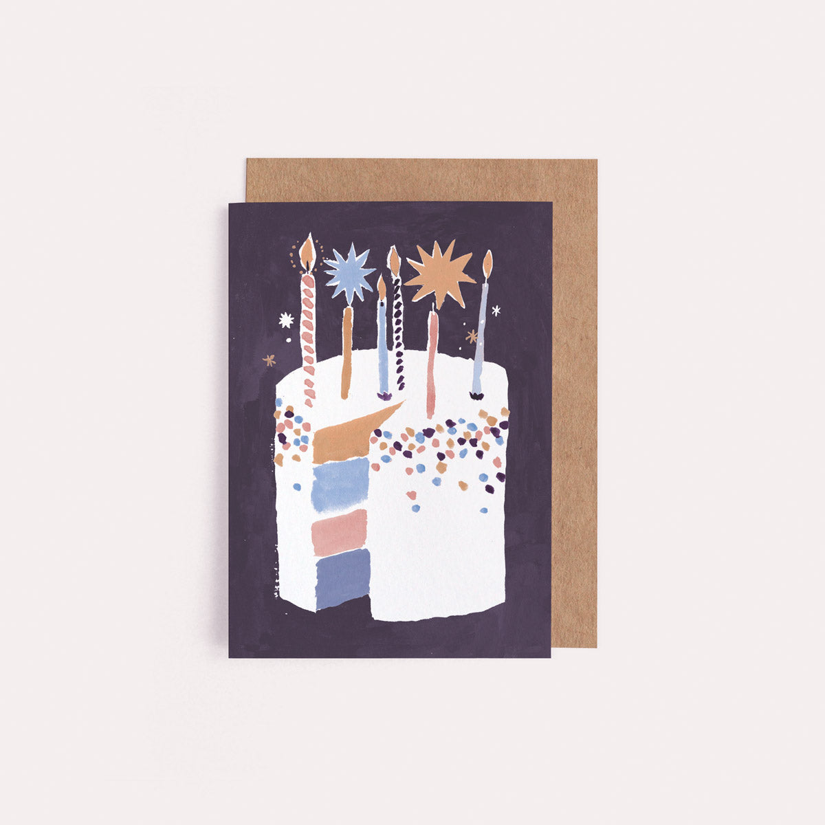 A mini birthday greeting card with an illustrated birthday cake and stars from the wholesale birthday card collection at Sister Paper Co.