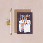 A mini birthday greeting card with an illustrated birthday cake and stars from the wholesale birthday card collection at Sister Paper Co.