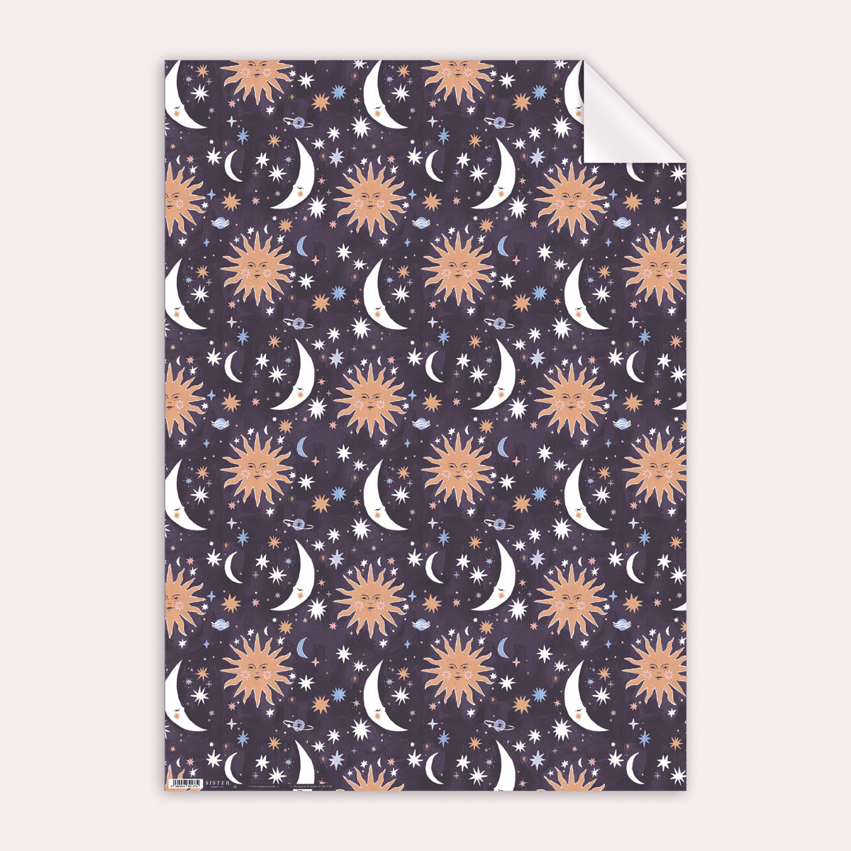 A sun and moons print adorns this sun gift wrap from the wholesale wrapping paper sheets collection at Sister Paper Co.