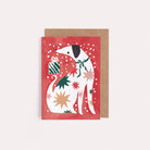 A mini Christmas card with an illustrated dog from the wholesale mini Christmas card collection at Sister Paper Co.