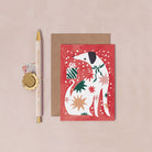 A mini Christmas card with an illustrated dog from the wholesale mini Christmas card collection at Sister Paper Co.