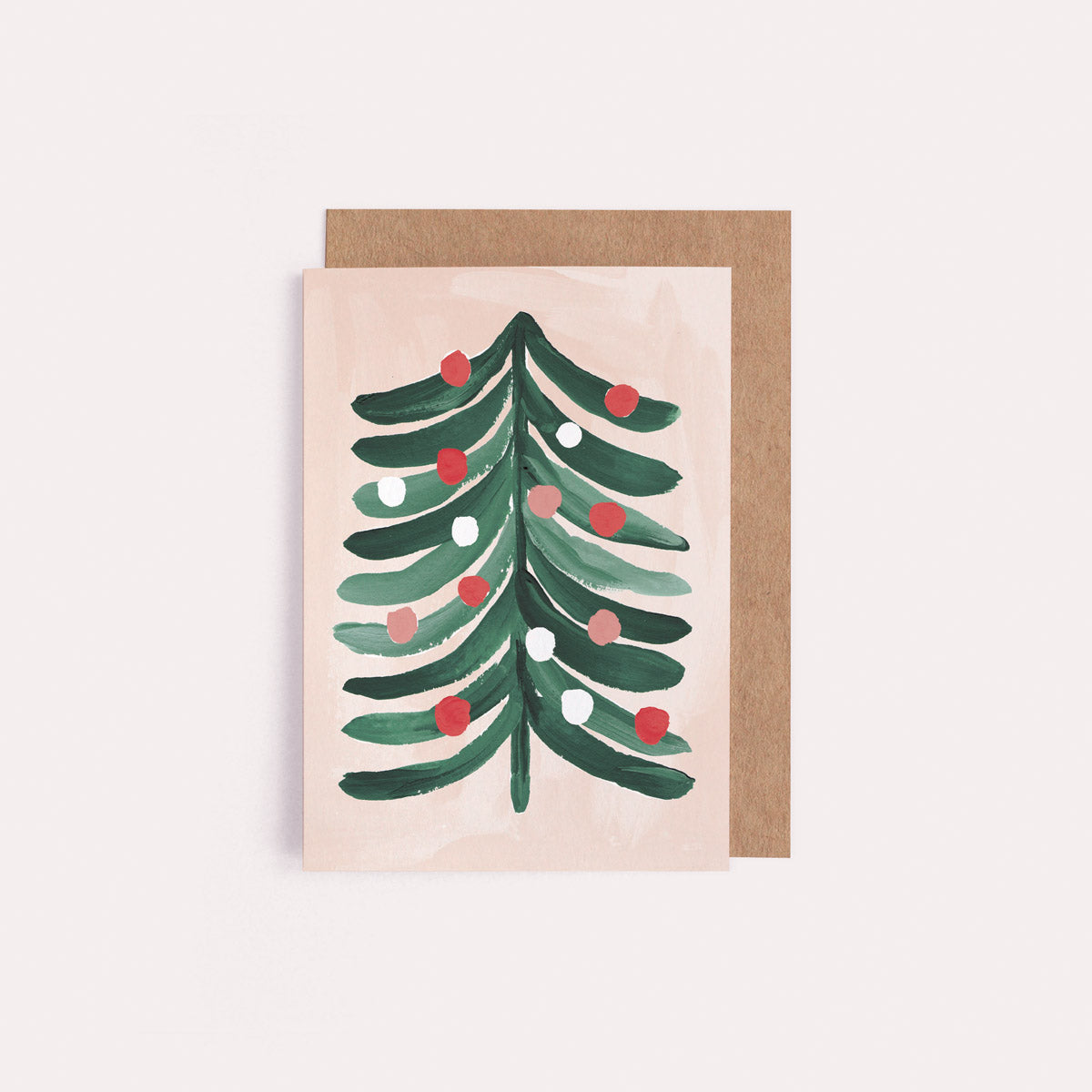 A mini Christmas card with an illustrated Christmas tree from the wholesale mini Christmas card collection at Sister Paper Co.