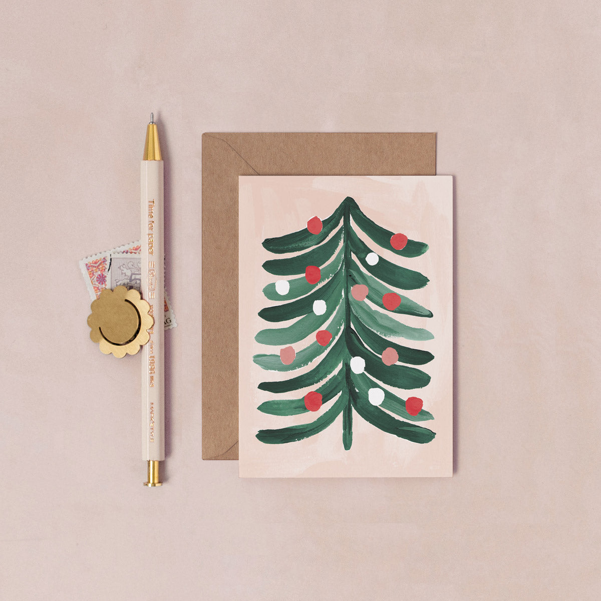 A mini Christmas card with an illustrated Christmas tree from the wholesale mini Christmas card collection at Sister Paper Co.