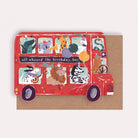 A kids birthday card cut into the shape of bus full of animals from the wholesale Childrens card collection at Sister Paper Co.