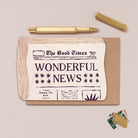 Newspaper congratulations card design shown close up