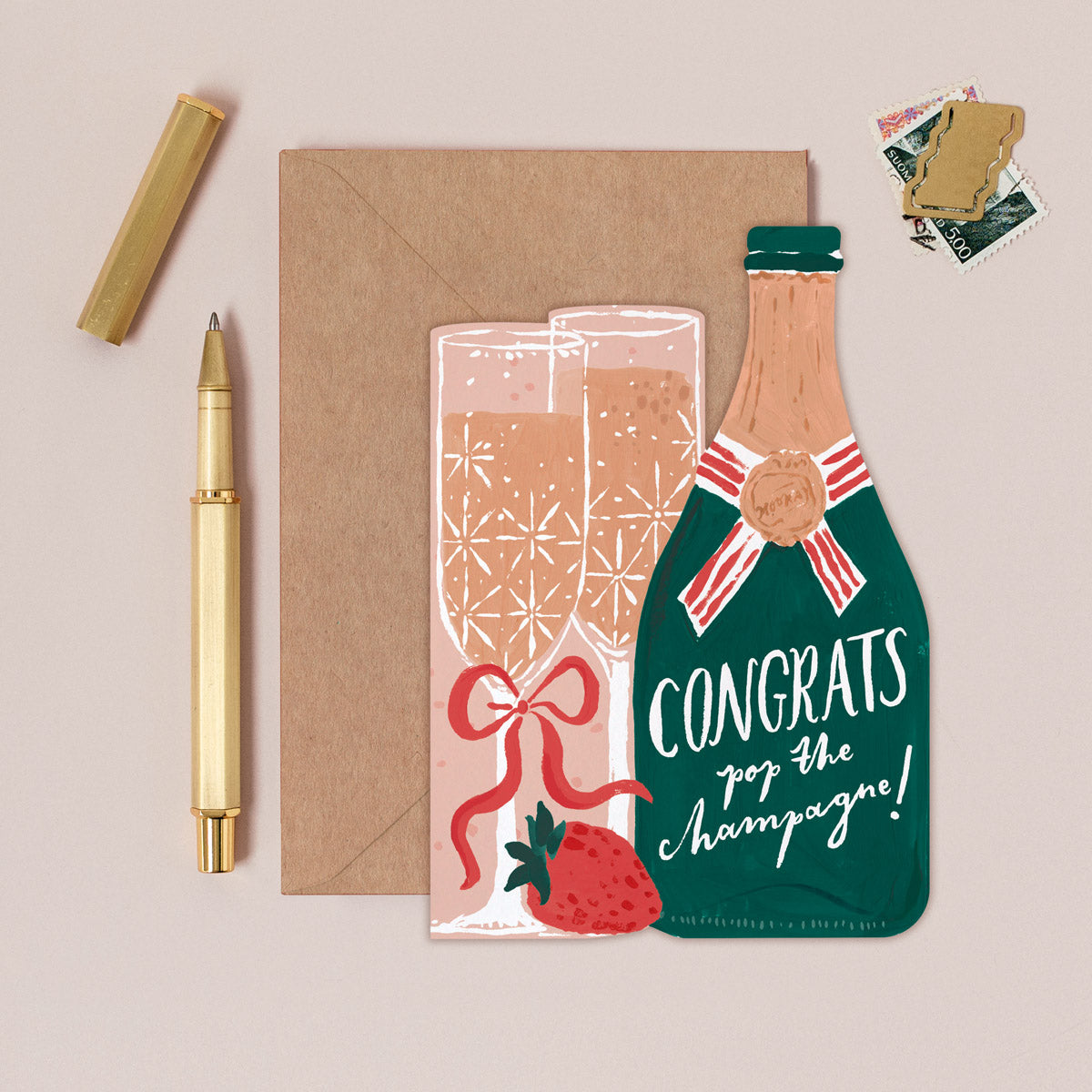 Champagne congratulations card design shown close up