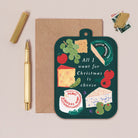 Chessboard Christmas card with cheese-themed illustration and envelope on a beige background