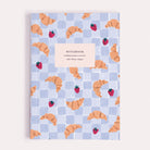 Croissant Cafe notebook, A5 plain page journal with a croissants and strawberries cover