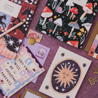 Sister Paper Co cards and notebooks styled together