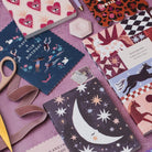 Sister Paper Co cards and notebooks styled in a flat lay