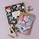 Sister Paper Co cat birthday card and notebook styled together