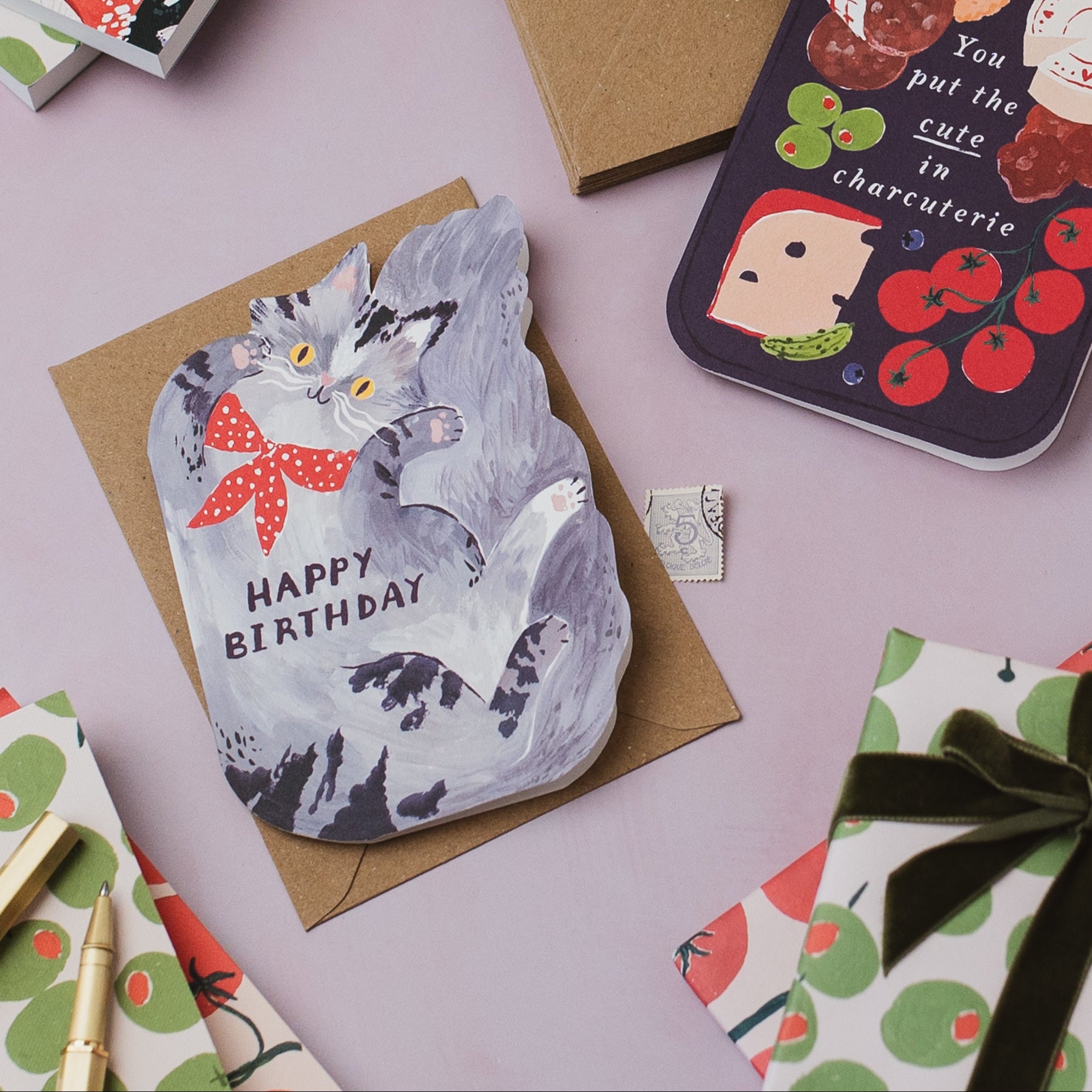 Sister Paper Co cards, notebook and gift wrap styled in a flat lay