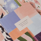 Collection of colorful planners with various designs and a 'Daily Planner' label.