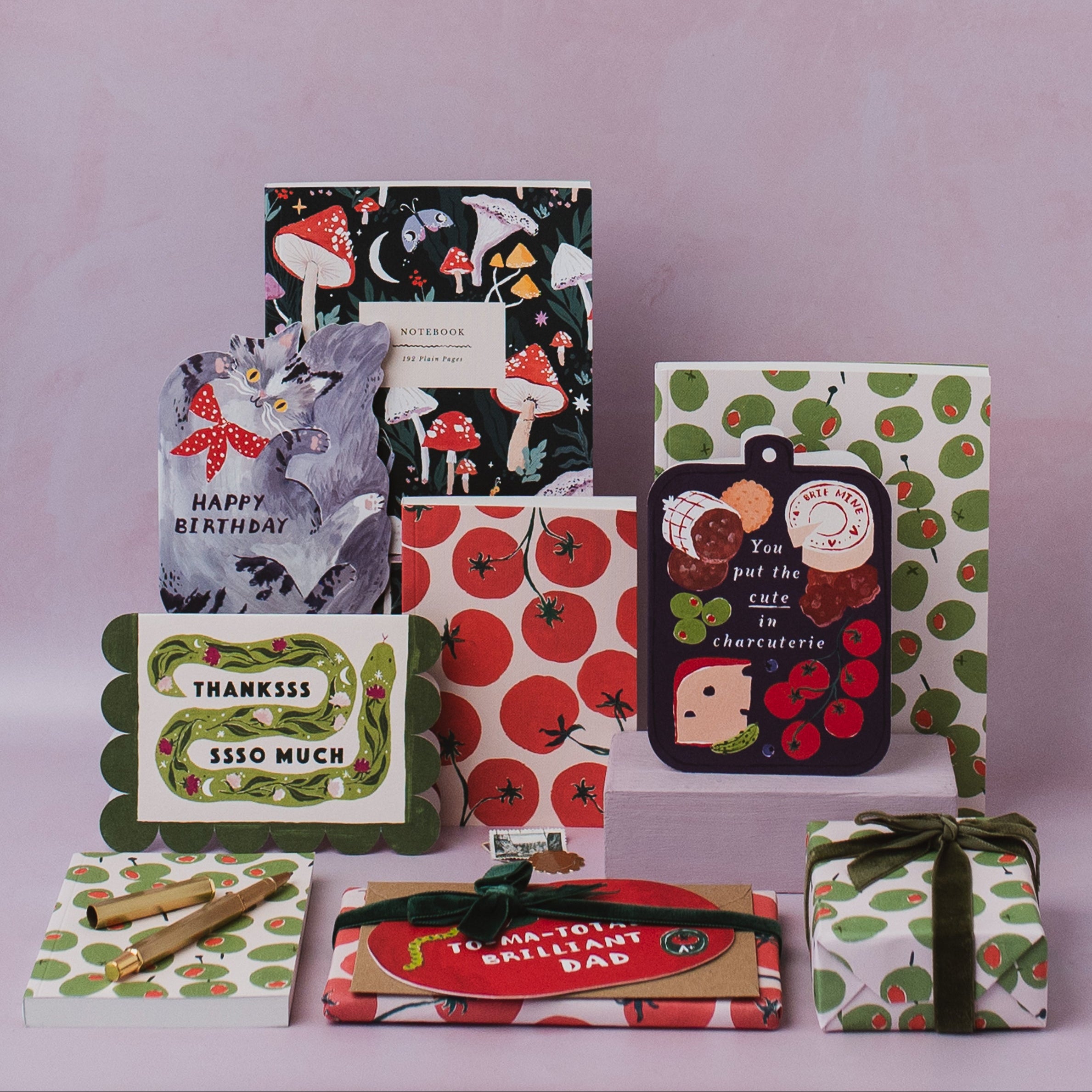 Sister Paper Co cards, notebooks and gift wrap styled in a flat lay