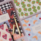 Sister Paper Co notebooks and pocket notebooks in a flat lay