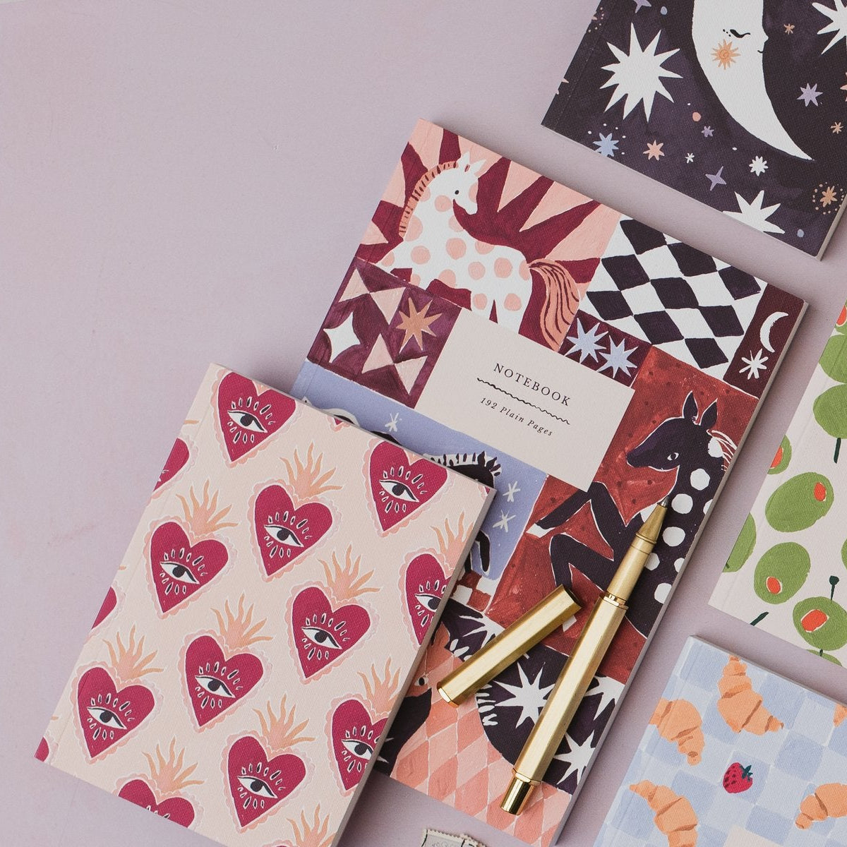 Sister Paper Co notebooks in a styled flat lay