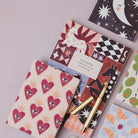 Sister Paper Co notebooks in a styled flat lay