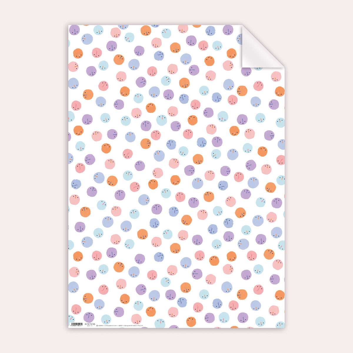 A cute smiley faces pattern on wrapping paper from the birthday wrapping paper collection at Sister Paper Co.