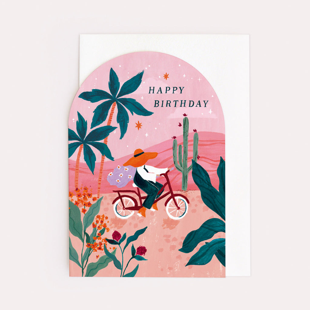 A birthday card with cyclist on bike and sunset illustration on a birthday card from the female birthday card collection at Sister Paper Co.