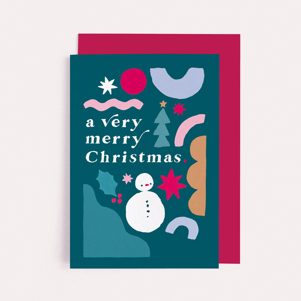 A rainbow with fun merry and bright lettering on a Christmas card from the colourful, rainbow Christmas card collection at Sister Paper Co.