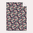 A mystical, floral snake print on wrapping paper from the female birthday wrapping paper collection at Sister Paper Co.