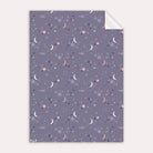 A cosmic, solar system print on wrapping paper from the female birthday wrapping paper collection at Sister Paper Co.